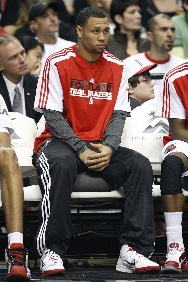 Brandon Roy watches the game from the bench in the second quarter of Monday's game against Milwaukee.