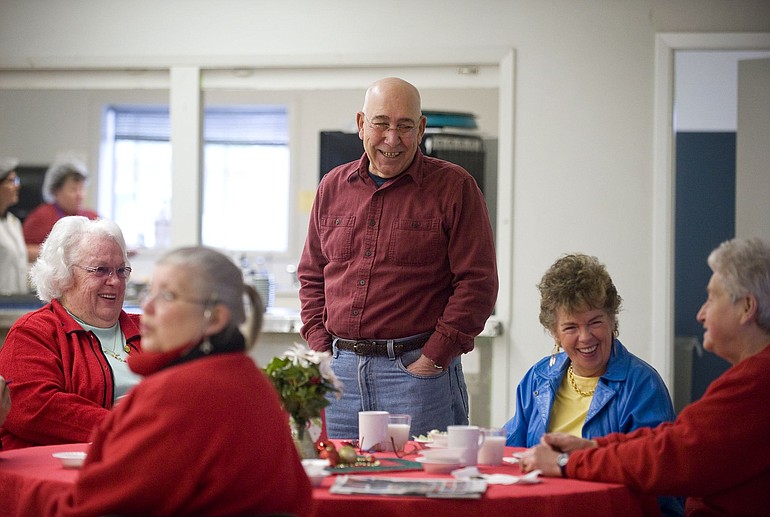 La Center City Councilman Al Luiz greets a group of Woodland residents at a senior lunch event Thursday at the La Center Community Center. Loaves and Fishes provides hot meals twice a week to seniors in the La Center area.