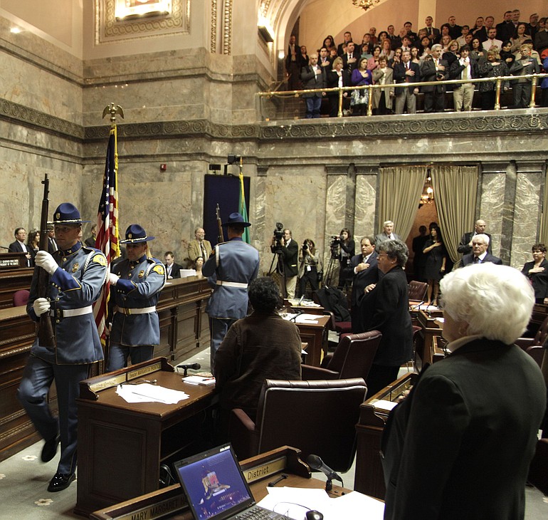 A Washington State Patrol honor guard presents the colors on the opening day of the 2011 Washington state legislative session on Monday at the Capitol in Olympia.