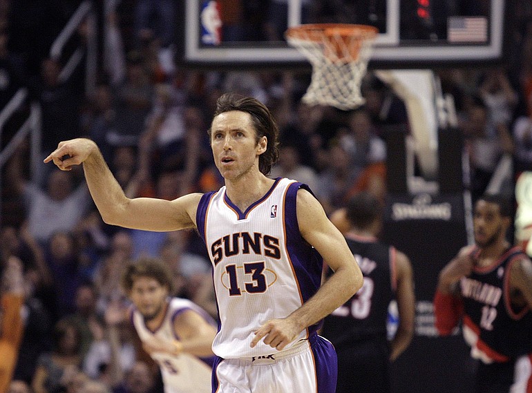 Phoenix Suns guard Steve Nash reacts after making a three-point field goal against the Portland Trail Blazers in the fourth quarter of an NBA basketball game Friday, Jan. 14, 2011, in Phoenix. The Suns won 115-111.