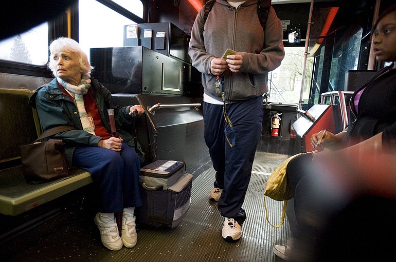 Donna Hamilton, 71, rides a C-Tran bus on Fourth Plain Boulevard on Friday.