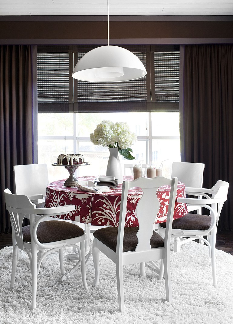 Brian Patrick Flynn created this dining room for HGTV.com by updating mismatched flea market chairs with the same color spray paint and cushion fabric for a high-end look on a tight budget.