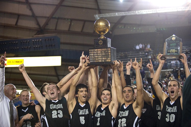 The Union boys basketball team hoisted the Class 3A state championship trophy after a win over Enumclaw last season.