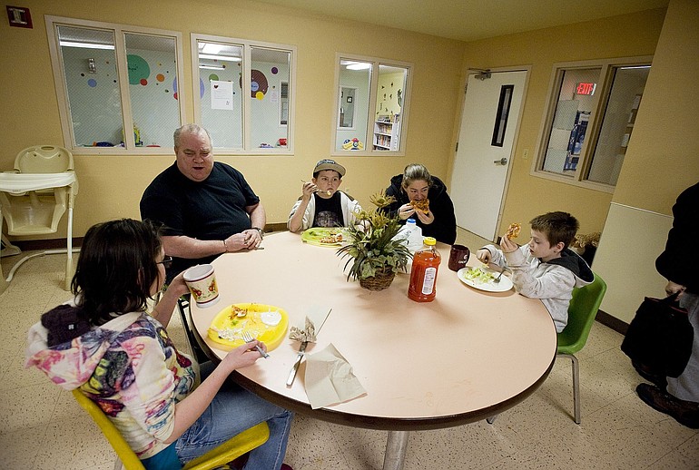 The Jewell family, from left, Sandy, 11, Doug, D.J., 10, Casey and Charlie, 9, eat dinner at Share Orchards Inn last week.