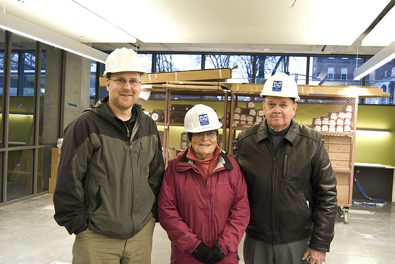 Adin Dunning, left, of The Miller/Hull Partnership and lead architect for the new Vancouver Community Library under construction on C Street, led a tour of the unfinished building in January for Pat and Don Cassady.