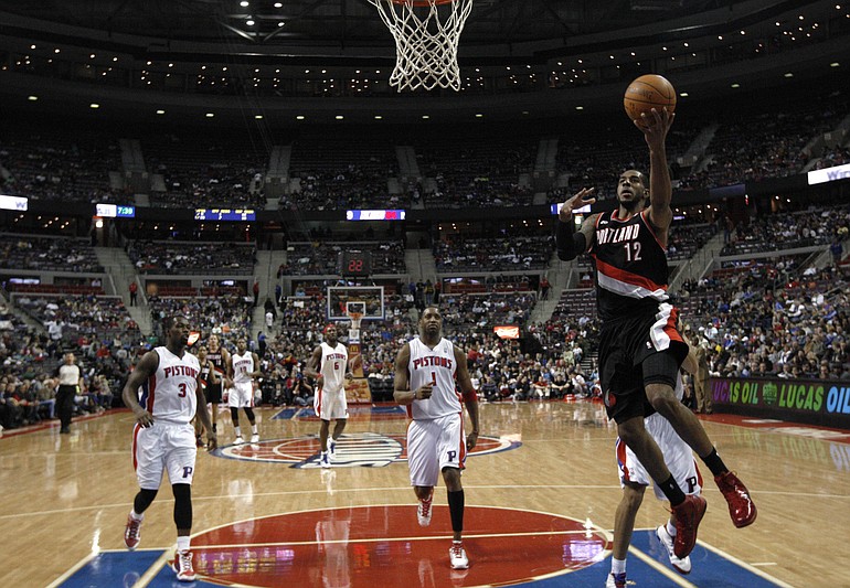 Portland's LaMarcus Aldridge (12) breaks away for two of his 36 points against the Detroit Pistons on Sunday.