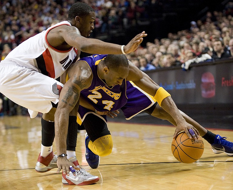 The Blazers' Wesley Matthews, left, puts pressure on the Lakers' Kobe Bryant during the Lakers' overtime win Wednesday in Portland.
