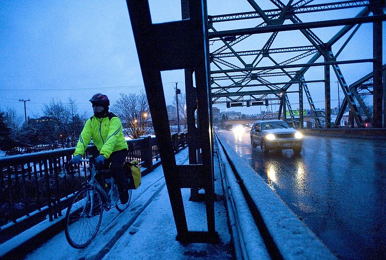 Traffic flows freely on the Interstate Bridge early Thursday morning despite the snow.