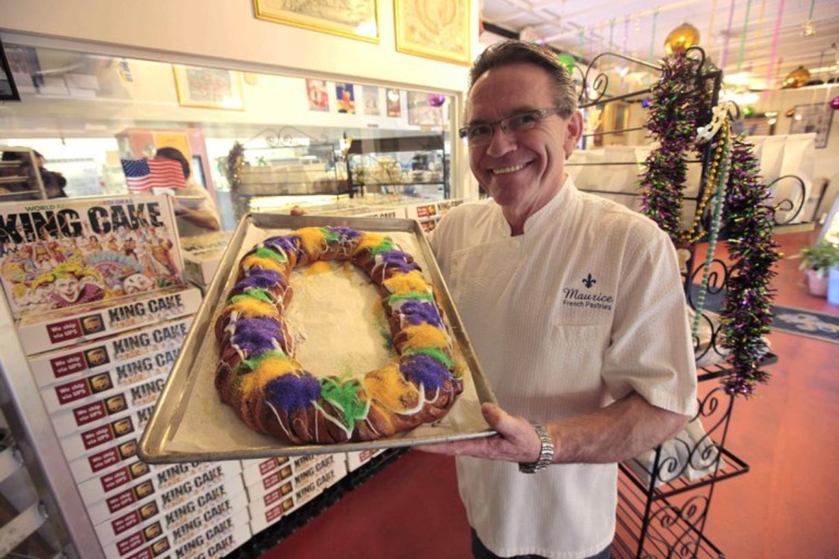 Pastry chef Jean-Luc Albin shows off some of his Mardi Gras King Cake creations Feb.