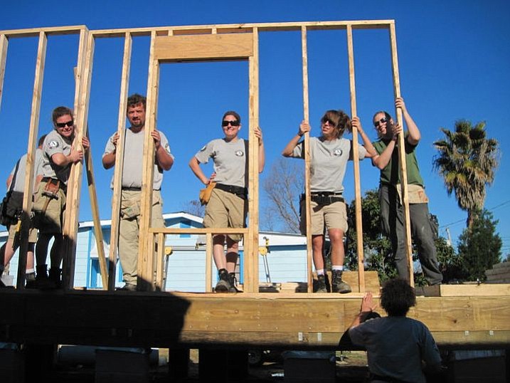 Megan Wills, center, is the team leader for a group of AmeriCorps workers who were helping Habitat for Humanity build homes in the New Orleans area.