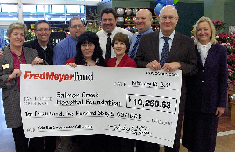 Fred Meyer officials present a check for more than $10,000 to Legacy Salmon Creek Medical Center representatives at Fred Meyer's Salmon Creek store.