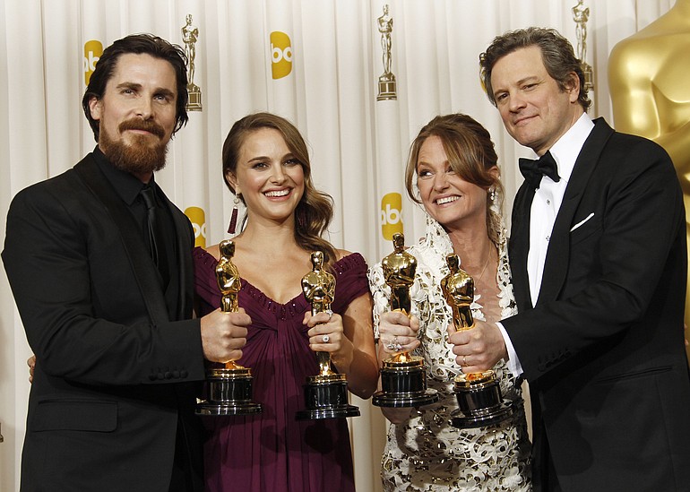 Christian Bale, from left, best supporting actor, Natalie Portman, best actress, Melissa Leo, best supporting actress, and Colin Firth, best actor, pose backstage Sunday with their Oscars at the 83rd Academy Awards in Los Angeles.
