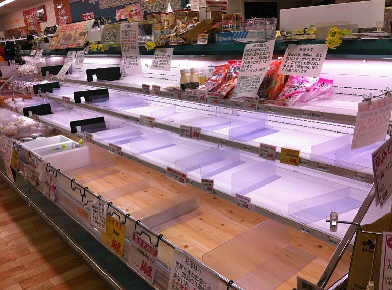 Empty supermarket cases have residents of Hirosaki, Japan, wondering when the next food shipment will arrive.