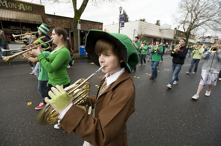 Adam Bauman marches with the Discovery Middle School band in the Paddy Hough Parade on Thursday in Vancouver.