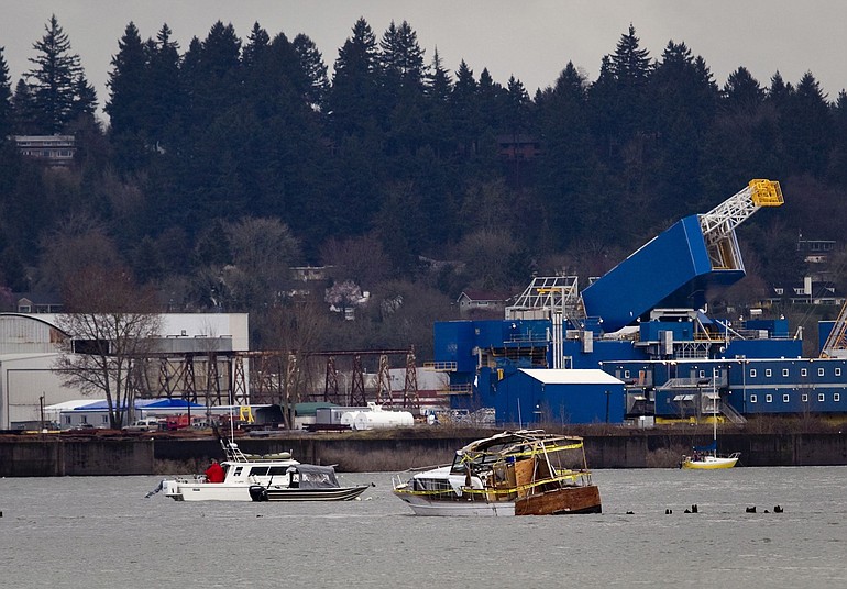 It's not just barges that are causing headaches on the Columbia River this winter. Here, a smaller vessel is stranded on the piers of a wing dam off the eastern tip of Hayden Island.