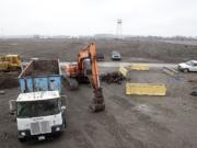 Crews at the Port of Vancouver's Terminal 5 move rocks and gravel to prepare the area to store wind energy components in 2015.