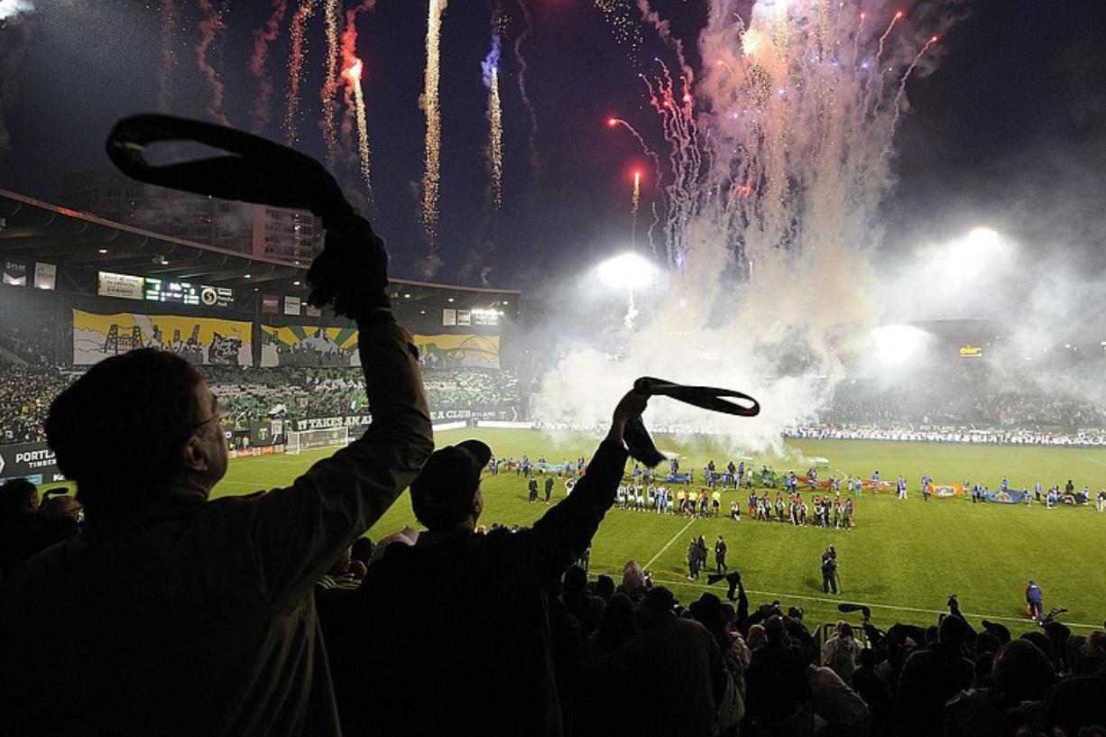 Portland Timber fans celebrate the during a fireworks display before the start of Portland Timbers first home game against Chicago Fire at Jeld-Wen Field on Thursday in Portland.
