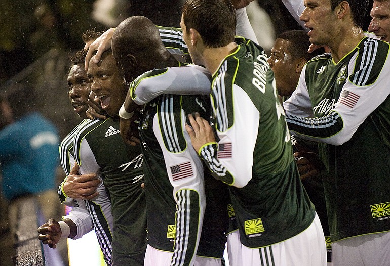 Rodney Wallace celebrates the Timbers' second goal on Thursday with teammates.