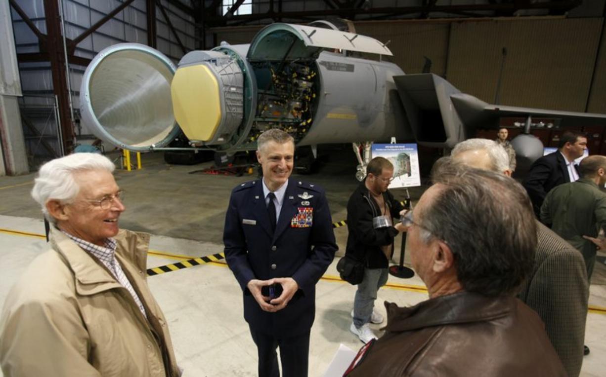 Brig. Gen. Steven Gregg, center, talks with well-wishers at Oregon Air National Guard's anniversary celebration.