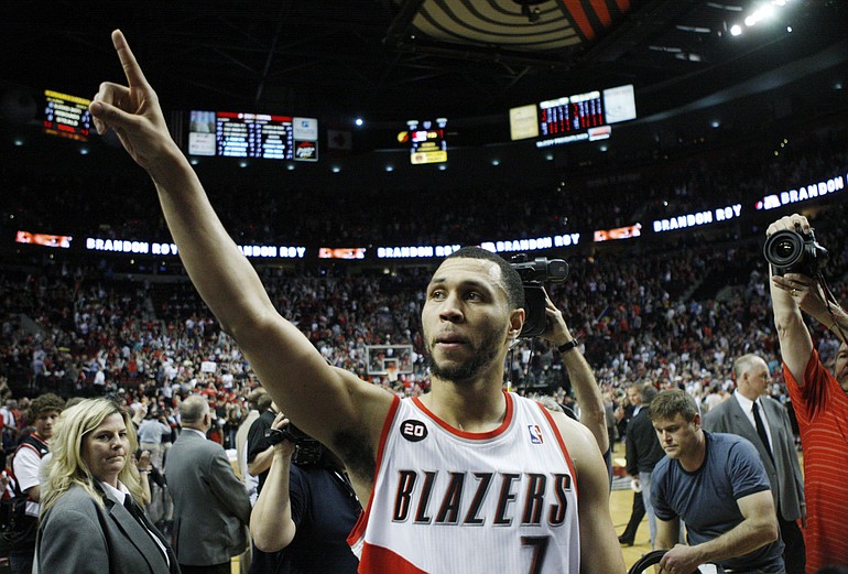 Portland Trail Blazers' Brandon Roy (7) points to the crowd after defeating the Dallas Mavericks 84-82 in Game 4 of their NBA basketball first-round playoff series on Saturday, April 23, 2011, in Portland, Ore.