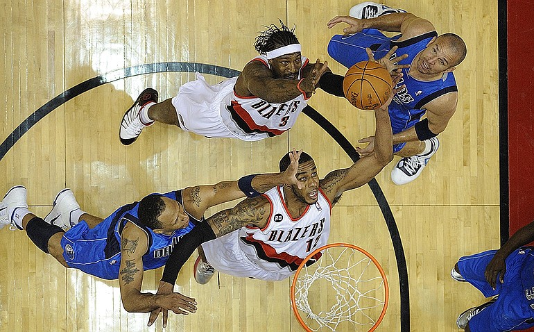 Portland's Gerald Wallace (3) and LaMarcus Aldridge (12) go for a rebound over Shawn Marion, left, and in front of Jason Kidd during Saturday's Game 4.