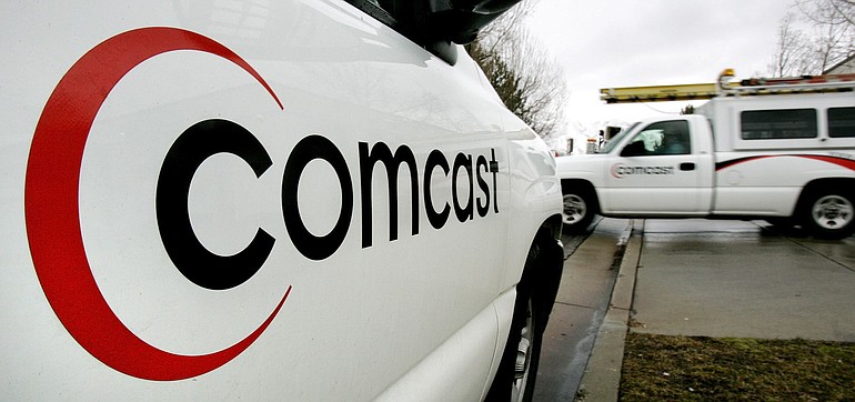A technician for Comcast heads out on a job in Salt Lake City.
