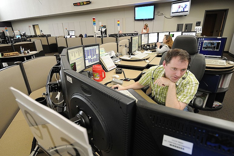 John Gaylord, graveyard supervisor at the CRESA 911 dispatch center, takes calls last June.