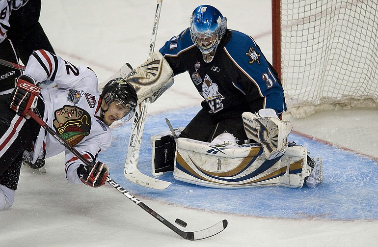 Winterhawks' Nino Niederreiter gets knocked down before he can get a solid shot on Kootenay Ice goaltender Nathan Lieuwen in the third period of Game 1 of the WHL finals at the Rose Garden on Friday.