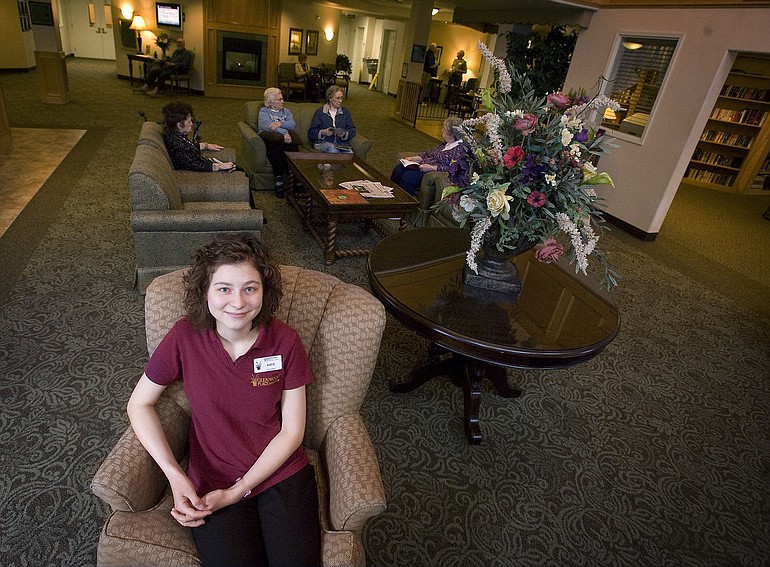 Katie Drokin, 18, a Prairie senior who is a Certified Nurses Assistant, or CNA, poses for a portrait on Wednesday May 11, 2011, at Glenwood Senior Living in Vancouver where she works part-time.
