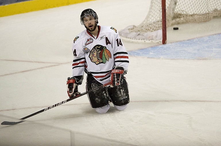Winterhawks' Craig Cunningham looks up with dejection after the Kootenay Ice score an empty net goal to secure a 4-1 win in Game 5 and clinch the Western Hockey League title Friday at the Rose Garden.
