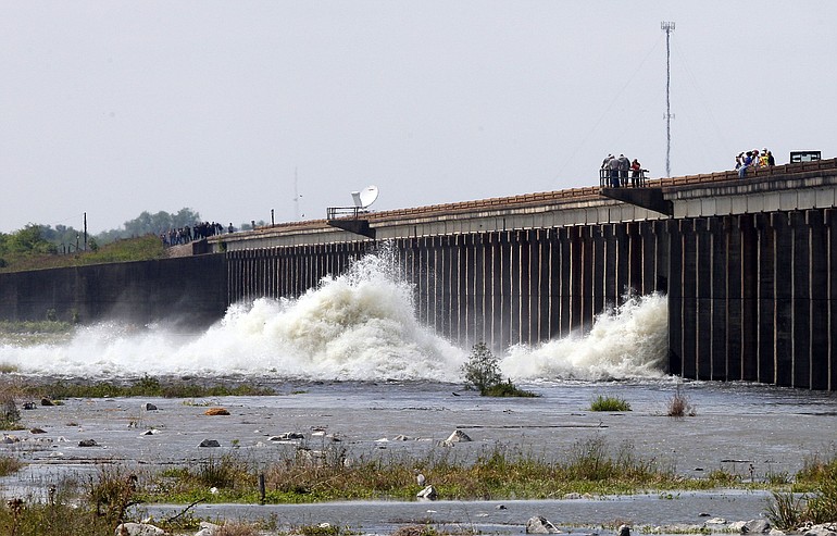 Water diverted from the Mississippi River spills through a bay in the Morganza Spillway in Morganza, La., Saturday.