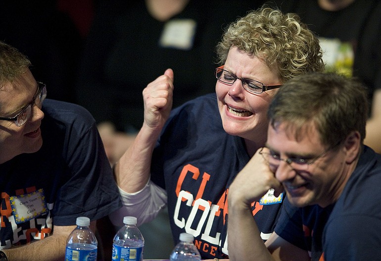 Clark College team members Tim Cook, left, Becky Merritt and Andrew Long react after misspelling &quot;vitreous&quot; during The Magic Spell, an adult spelling bee Sunday that raised money for scholarships and the library, at the Emil Fries Auditorium at the Washington State School for the Blind.