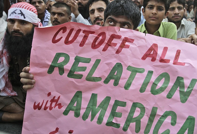 Supporters of Pakistani religious group Jamaat-ud-Dawa, listen to their leaders during a rally to condemn the United States for the killing of al-Qaida leader Osama bin Laden, Sunday in Lahore, Pakistan.