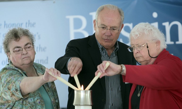 Sister Chauncey Boyle, from left, PeaceHealth Southwest Medical Center board president Lee Kearney and Sister Kathleen Pruitt light candles at Southwest Washington Medical Center's blessing ceremony Tuesday.