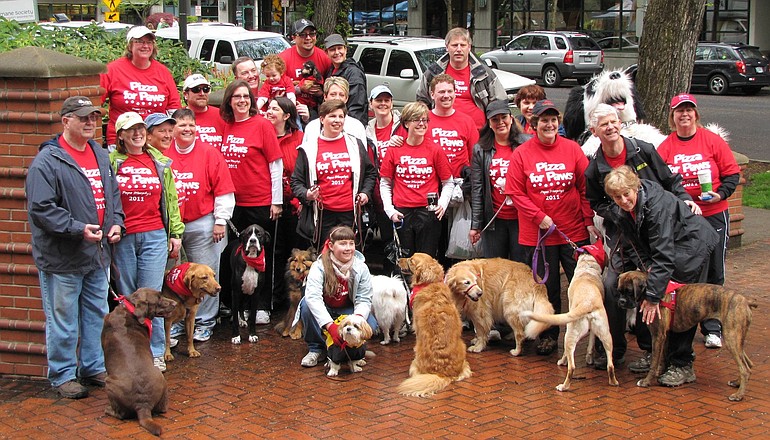 Humane Society for Southwest Washington volunteers Jerry and Maura Quilling, far left, with the Papa Murphy's pack of walkers.