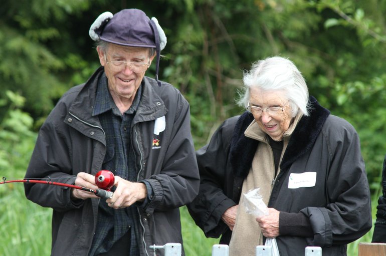 Old Evergreen Highway: Alford and Edna Folkerts enjoy the Senior Fishing Festival at Columbia Springs.