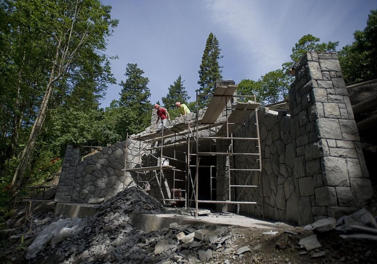 Masons construct the basalt facade of one of two new pedestrian tunnels under Highway 14 along the Cape Horn Trail.