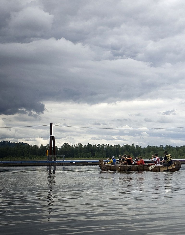 Members of Voyages of Rediscovery take a group of local residents on a short paddle on the Columbia River Thursday at the Port of Camas-Washougal.
