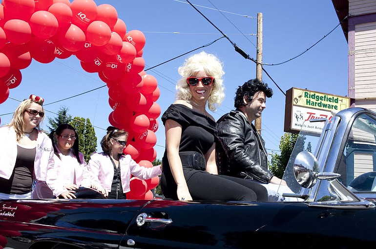 IQ Credit Union's float for Ridgefield's Fourth of July parade, &quot;Grease,&quot; included members dressed as Sandy (Jessica Allen) and Danny (Chris O'Malley).