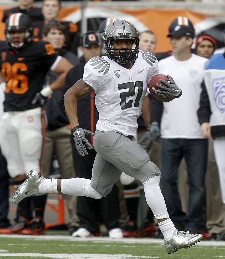Heisman Trophy finalist LaMichael James (21) is one of the players reportedly steered toward Oregon by recruiting &quot;street agent&quot; Willie Lyles.