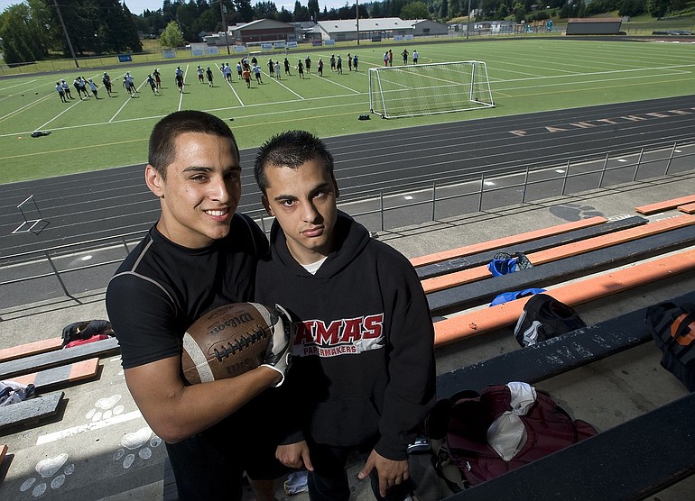Miguel Salamanca, left, who will play in the Freedom Bowl Classic that raises money for the Shriners Hospital, poses with his brother Roy.
