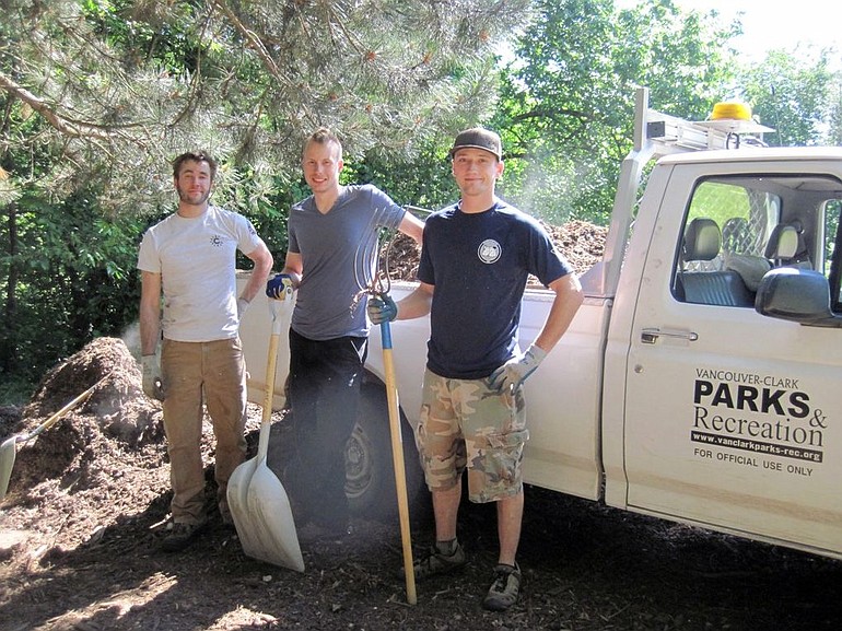 AmeriCorps Volunteer Colin Cushman, left, Stephen Sines and Chad Carter helped maintain the disc golf course at Leverich Park.