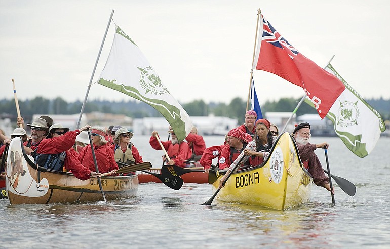 Members of the 2011 David Thompson Columbia River Canoe Brigade make their ceremonial landing at Marine Park, Monday.