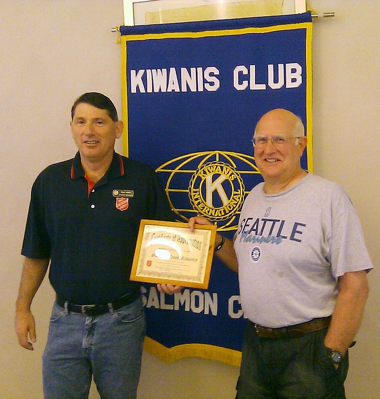Salmon Creek -- Dewey Weber of the Salvation Army, left, presents Bruce Davis, a member of Salmon Creek Kiwanis, with a plaque of appreciation.