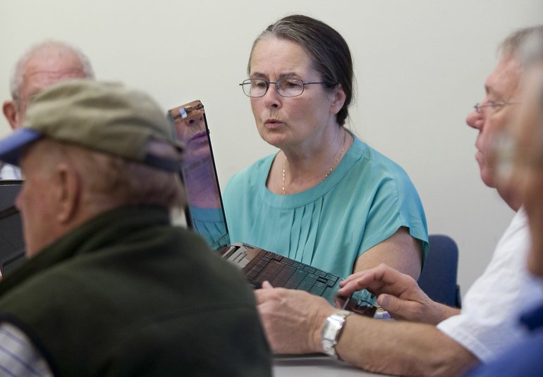 Patricia Halverson of Vancouver learns to attach photographs to emails during a computer club meeting for seniors at the Firstenburg Community Center last week.