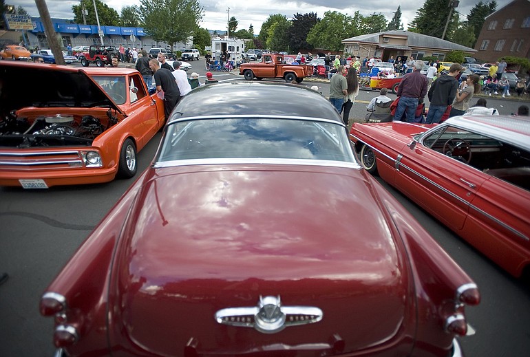 Classic cars were on display near the Dairy Queen on Main Street during Vancouver's annual &quot;Cruisin the Gut&quot; event on Saturday. Enthusiasts donated record amounts of food and cash for Share House, while police reported negligible problems with drivers or the large crowd of spectators.