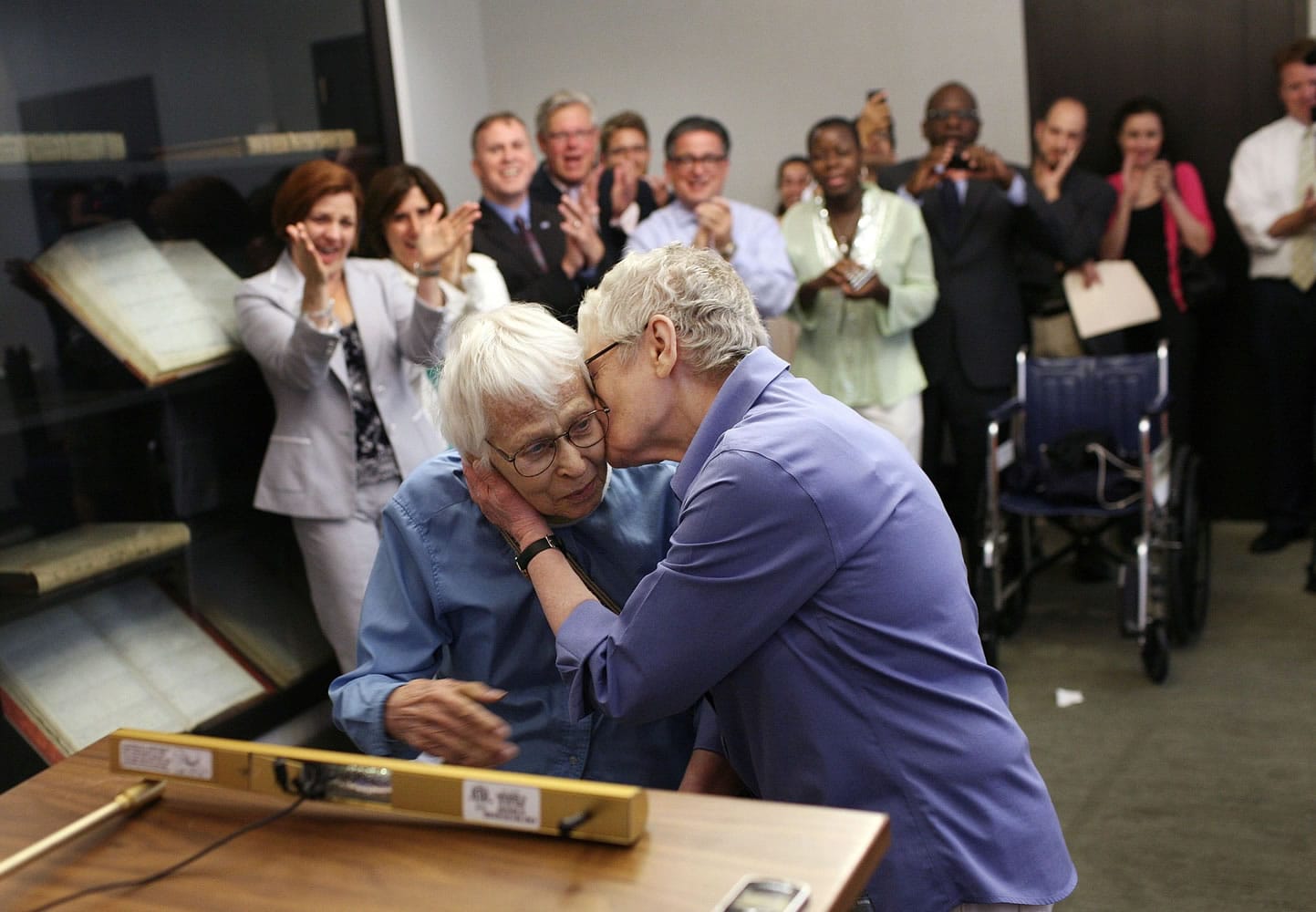 Phyllis Siegel, 77, right, kisses her wife Connie Kopelov, 85, after exchanging vows at the Manhattan City Clerk's office with New York City Council Speaker Christine C.