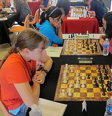 Heather Young, left, plays in the 2011 Susan Polgar International Championship, where she placed 18th.