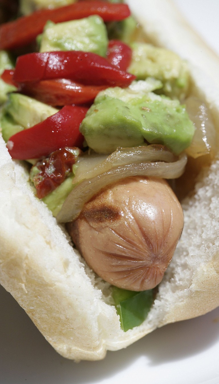 Spice up a hot dog with avocado, caramelized onions and sun-dried tomatoes.