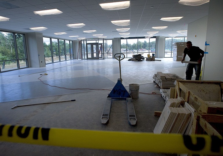 Construction work on the first-floor cafeteria at Fisher Investments' office campus continues in Camas.